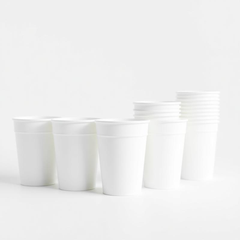 Blank white paper and plastic cups ready to be printed